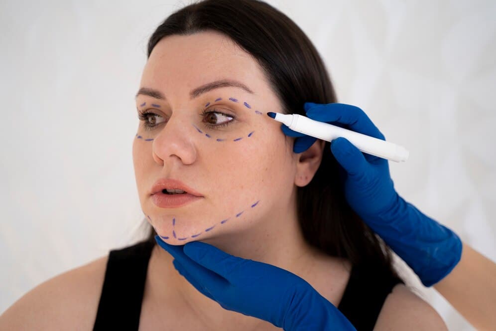 1768595271 side view hands drawing woman s face 23 2149350084 1